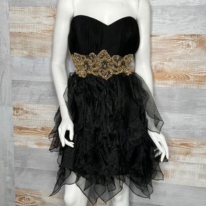 Prom sweet heart strapless dress in black with gold sequin waist band